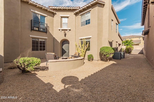 3964 E Hummingbird Ln, Phoenix, AZ 85050 - back of house with stucco siding, a tile roof, central air condition unit, and a patio area