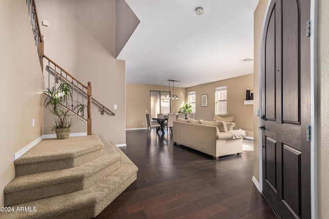 3964 E Hummingbird Ln, Phoenix, AZ 85050 - foyer entrance featuring stairway, dark wood-style floors, baseboards, and a chandelier