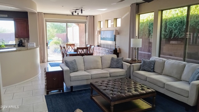 41318 N Belfair Way, Anthem, AZ 85086 - living area featuring light tile patterned floors, track lighting, and baseboards