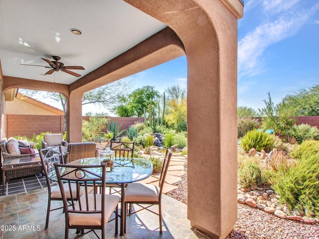 41318 N Belfair Way, Anthem, AZ 85086 - fenced backyard featuring a ceiling fan, a patio area, and outdoor dining area
