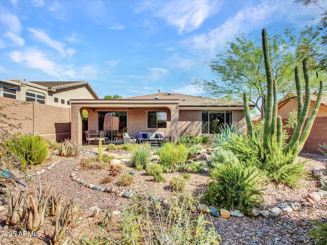 41318 N Belfair Way, Anthem, AZ 85086 - rear view of house with stucco siding and a patio