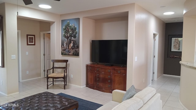 41318 N Belfair Way, Anthem, AZ 85086 - living room featuring light tile patterned floors, ceiling fan, and baseboards