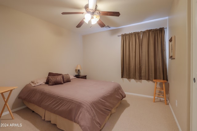 bedroom with light colored carpet and ceiling fan