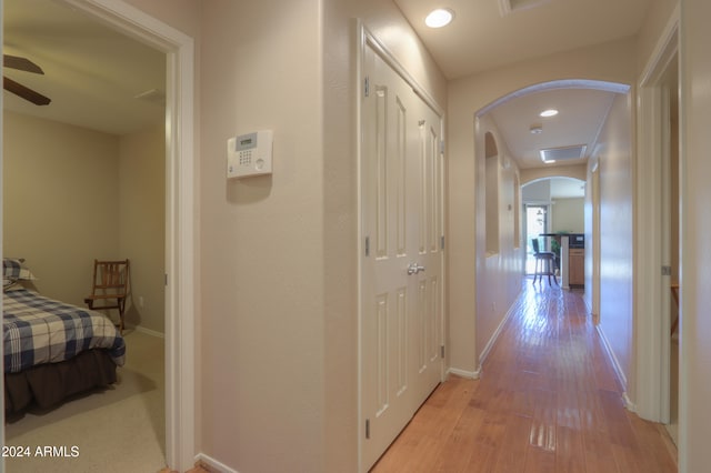 corridor featuring light hardwood / wood-style floors