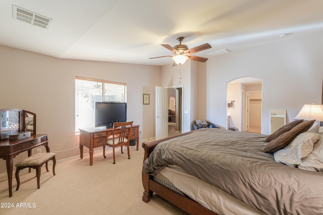 bedroom with lofted ceiling, light carpet, and ceiling fan