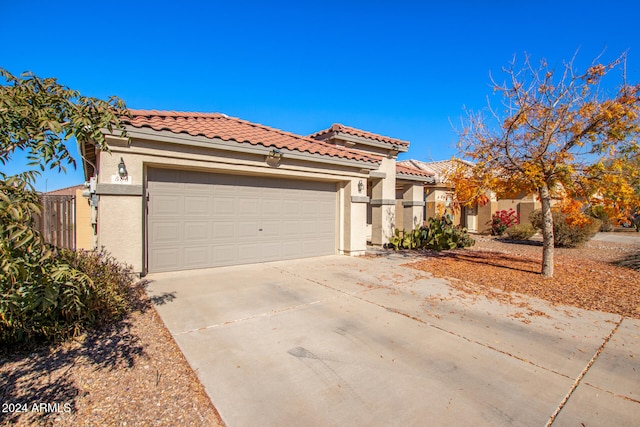 mediterranean / spanish-style house featuring a garage