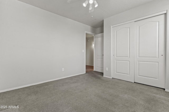 1135 W Sea Fog Dr, Gilbert, AZ 85233 - unfurnished bedroom with carpet flooring, a closet, and a ceiling fan