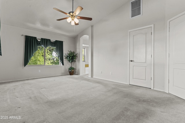 1135 W Sea Fog Dr, Gilbert, AZ 85233 - carpeted empty room with arched walkways, ceiling fan, and lofted ceiling
