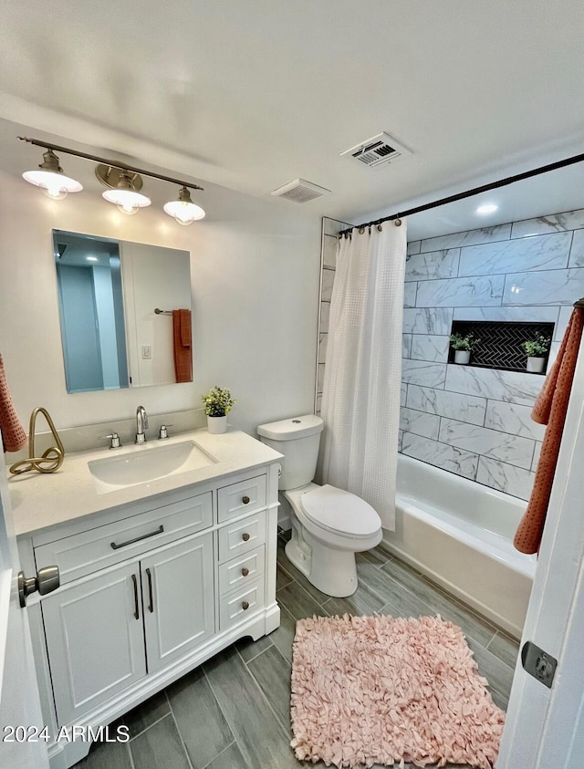 full bathroom with toilet, shower / tub combo with curtain, vanity, and hardwood / wood-style flooring