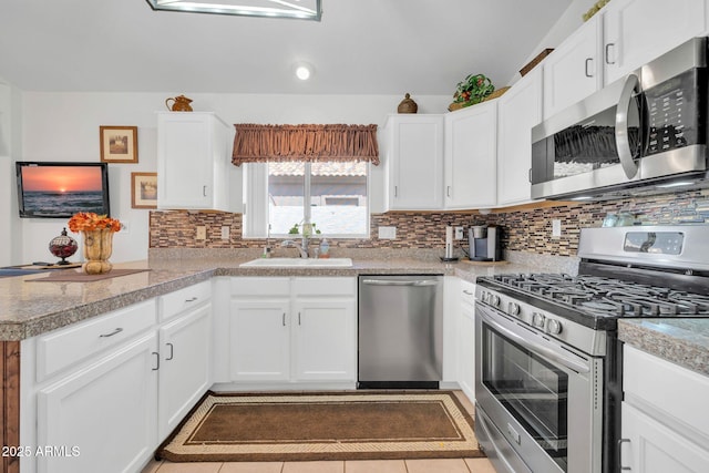 10745 W Beaubien Dr, Sun City, AZ 85373 - kitchen featuring white cabinets, appliances with stainless steel finishes, and tasteful backsplash