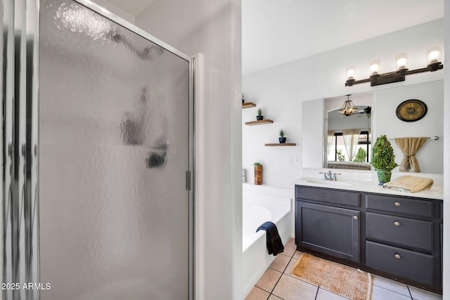 10745 W Beaubien Dr, Sun City, AZ 85373 - full bath with a shower stall, a bath, tile patterned floors, and vanity