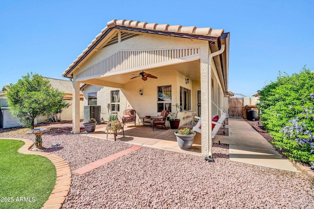 10745 W Beaubien Dr, Sun City, AZ 85373 - rear view of house featuring a gate, central air condition unit, a fenced backyard, a patio, and ceiling fan