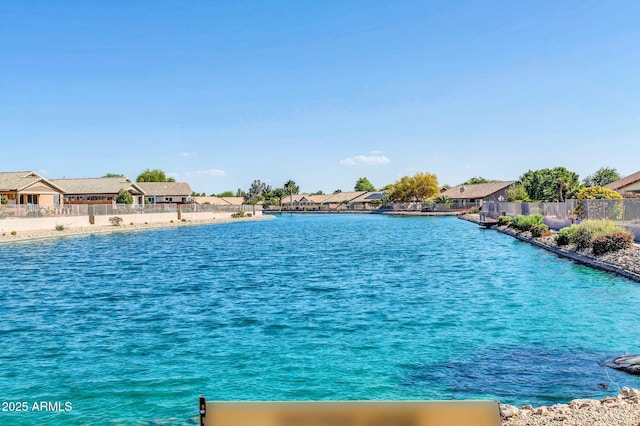 10745 W Beaubien Dr, Sun City, AZ 85373 - view of water feature with fence and a residential view