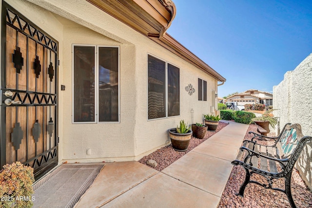10745 W Beaubien Dr, Sun City, AZ 85373 - view of property exterior with a patio and stucco siding