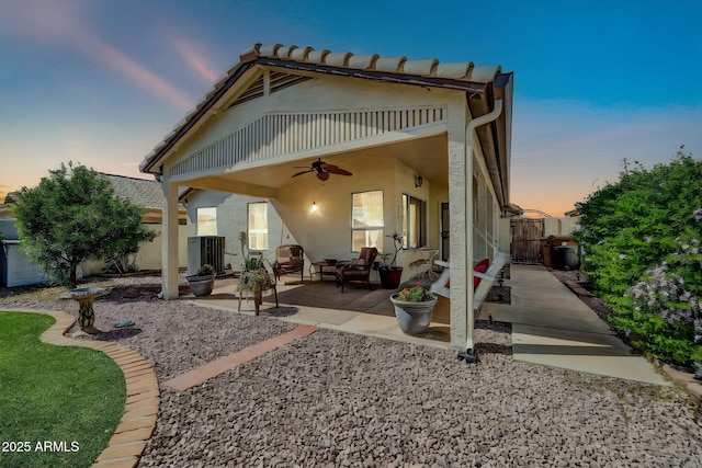 10745 W Beaubien Dr, Sun City, AZ 85373 - rear view of property featuring central AC, a patio area, fence, stucco siding, and ceiling fan