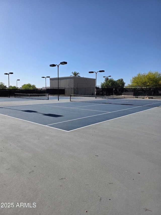 10745 W Beaubien Dr, Sun City, AZ 85373 - view of sport court featuring community basketball court and fence
