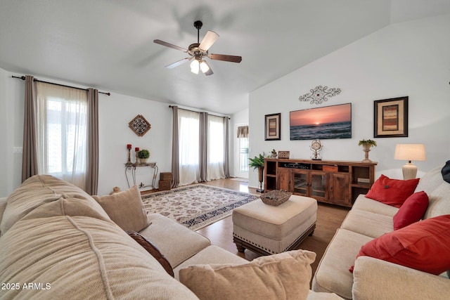 10745 W Beaubien Dr, Sun City, AZ 85373 - living room with vaulted ceiling, wood finished floors, a ceiling fan, and a healthy amount of sunlight