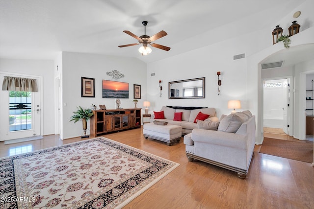 10745 W Beaubien Dr, Sun City, AZ 85373 - living room with a ceiling fan, visible vents, vaulted ceiling, and light wood-style flooring