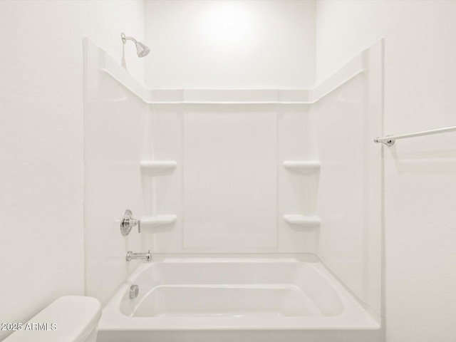 bathroom featuring toilet and shower / bathing tub combination