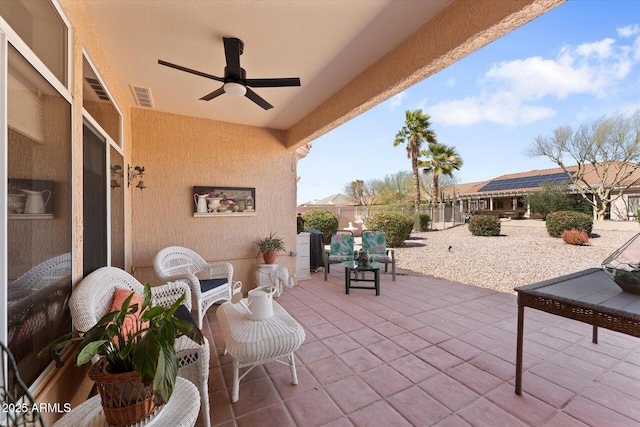 view of patio / terrace with visible vents, a ceiling fan, and fence