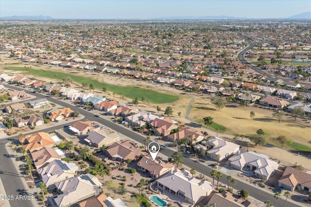 bird's eye view with view of golf course and a residential view