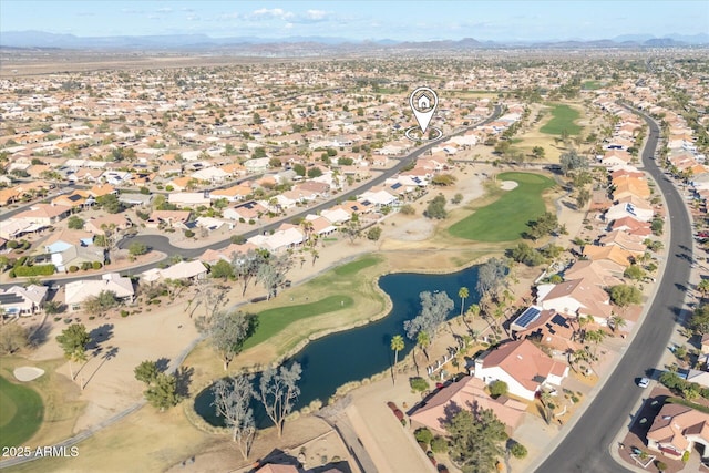 aerial view with a residential view, a water and mountain view, and view of golf course