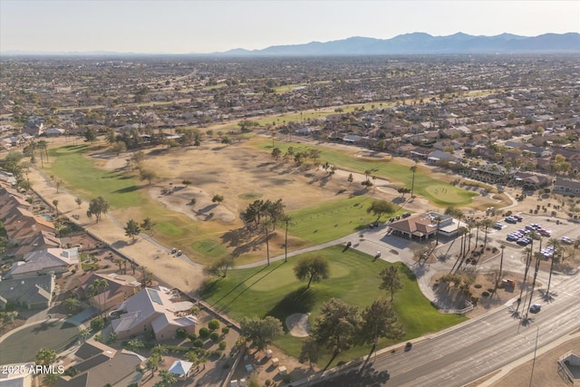 aerial view featuring a mountain view, golf course view, and a residential view