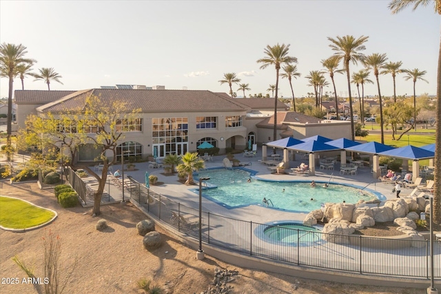 pool featuring a patio and fence