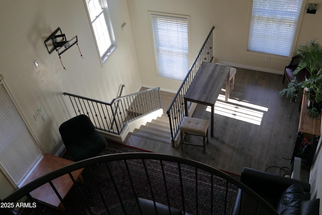5720 S 21st Ter, Phoenix, AZ 85040 - stairs with baseboards and wood finished floors
