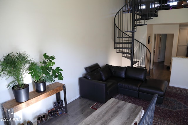 5720 S 21st Ter, Phoenix, AZ 85040 - living room featuring wood finished floors, stairs, and baseboards