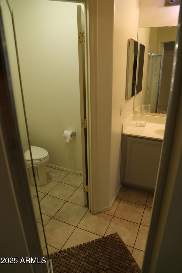 5720 S 21st Ter, Phoenix, AZ 85040 - full bathroom with toilet, tile patterned floors, vanity, and a shower