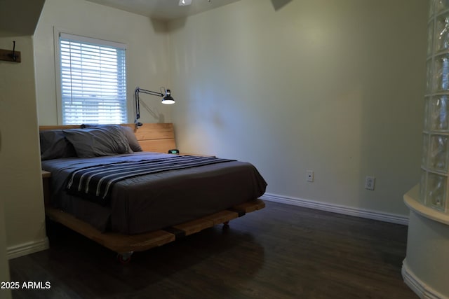 5720 S 21st Ter, Phoenix, AZ 85040 - bedroom featuring wood finished floors and baseboards