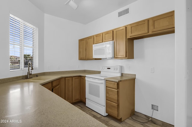 kitchen with sink and white appliances