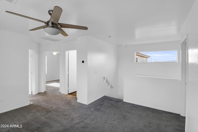 carpeted empty room with ceiling fan