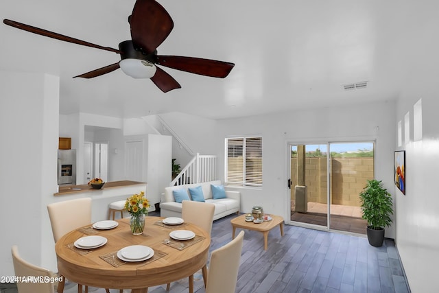 living room with ceiling fan and hardwood / wood-style flooring