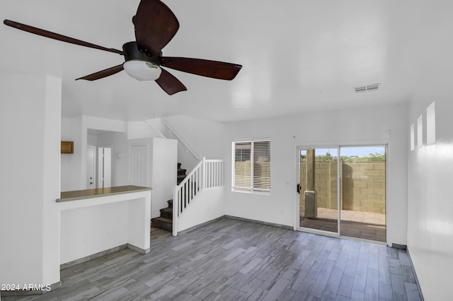 unfurnished living room with ceiling fan and light hardwood / wood-style floors