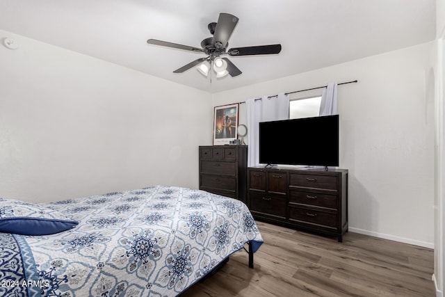 bedroom with ceiling fan and light wood-type flooring