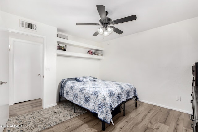 bedroom featuring ceiling fan and light hardwood / wood-style flooring