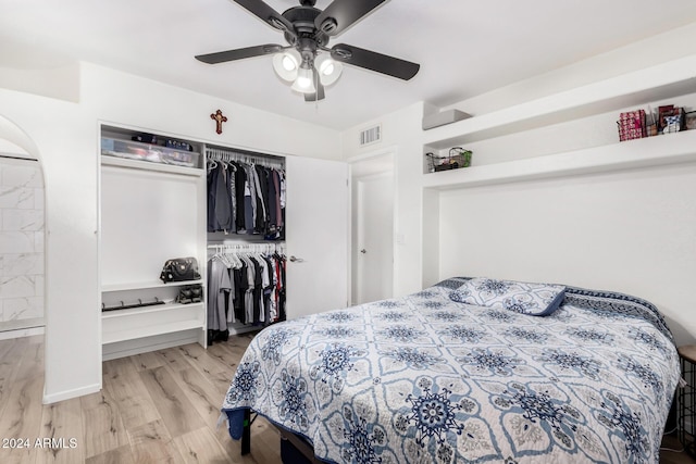 bedroom with ceiling fan and light hardwood / wood-style floors