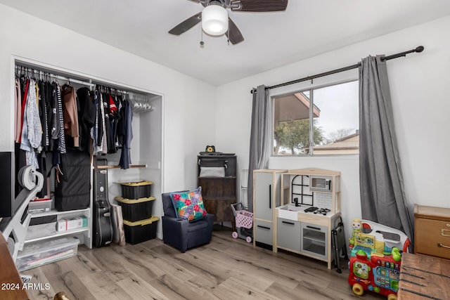 interior space with ceiling fan and light wood-type flooring