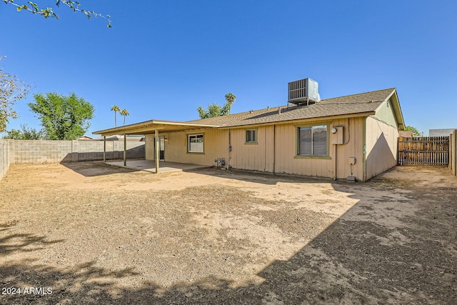 back of property with a patio area and central AC unit