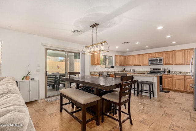 dining area featuring sink