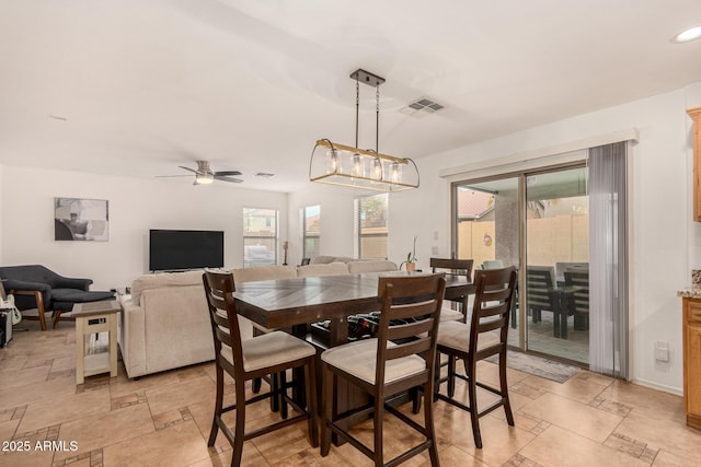 dining space featuring ceiling fan