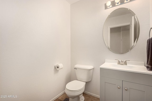 bathroom with toilet and vanity