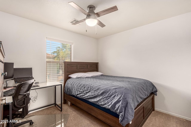 bedroom with ceiling fan and light colored carpet