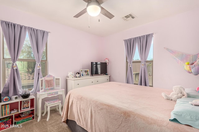 carpeted bedroom with ceiling fan