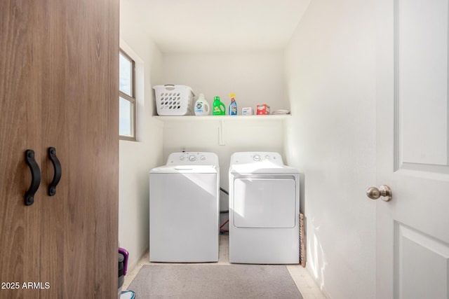 laundry room with separate washer and dryer