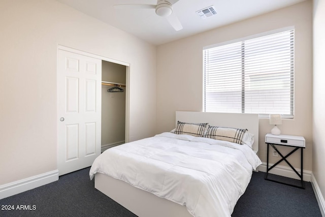 carpeted bedroom with a closet and ceiling fan