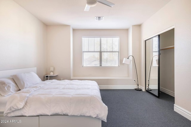 bedroom featuring ceiling fan and dark carpet