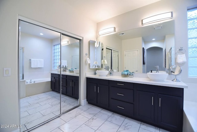 bathroom featuring a bathtub and vanity